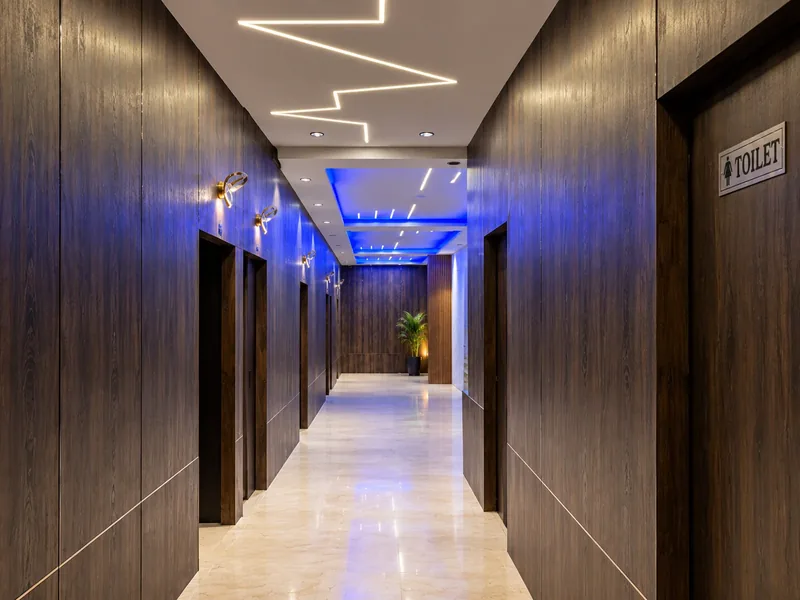 Blue-lit corridor at Velvet The Spa